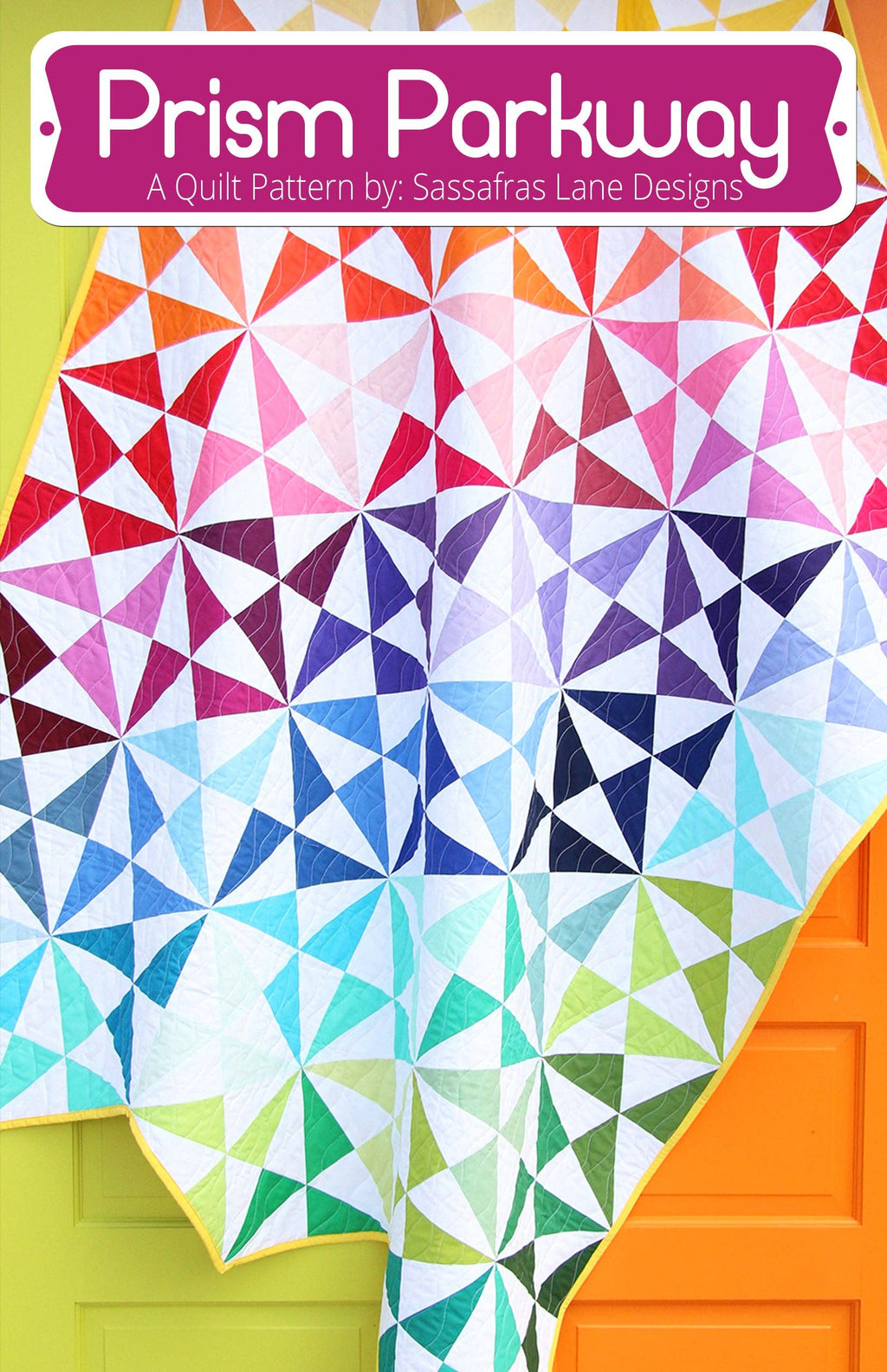 A colorful triangular quilt pattern displayed on a surface with the text 'Prism Parkway A Quilt Pattern by Sassafras Lane Design' at the top.