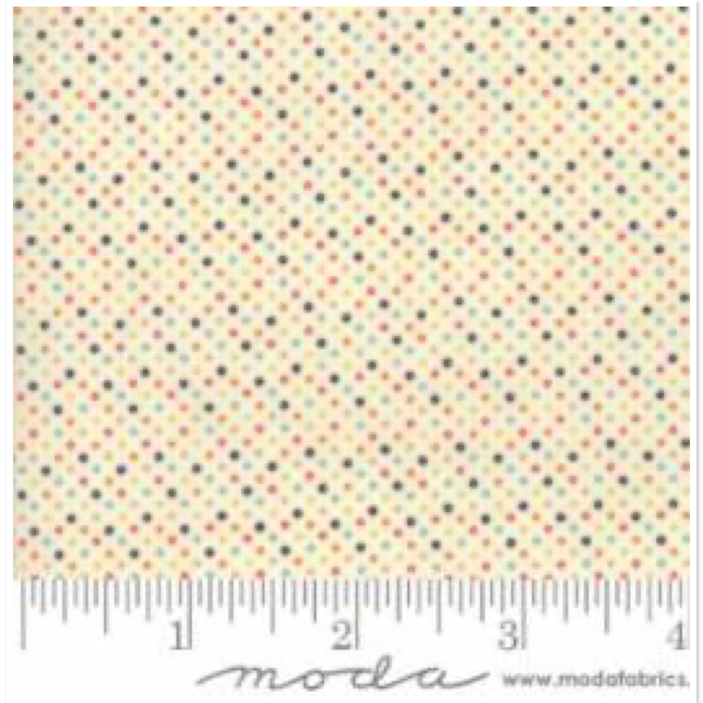 A piece of white multi-colored fabric with a dotted pattern, indicating it is a textile product suitable for arts and crafts.