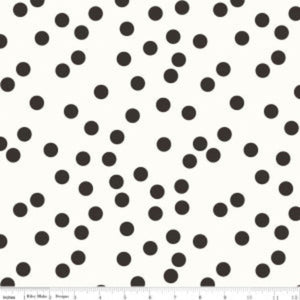 A fabric with a pattern of black dots on a white background, part of the "Yes, Please" collection.