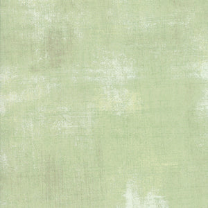 Solid light green color swatch with a textured pattern