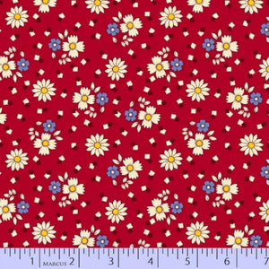 Floral pattern on red fabric with a ruler at the bottom